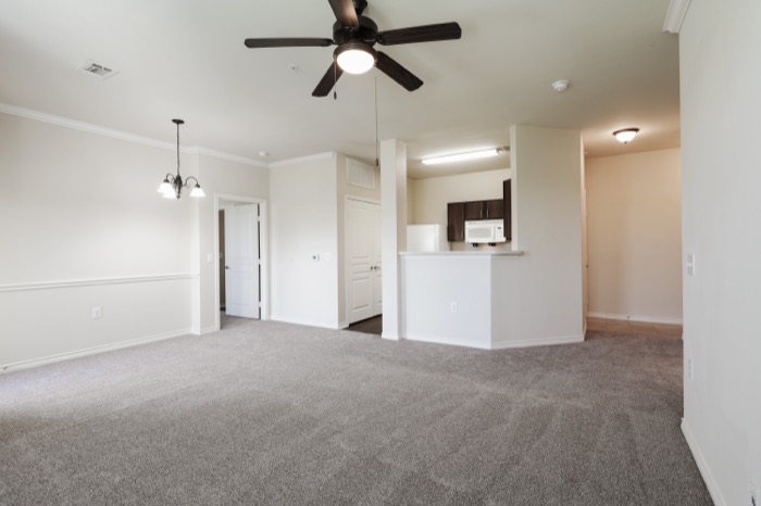 Apartment living area and kitchen at Villas on Calloway Creek